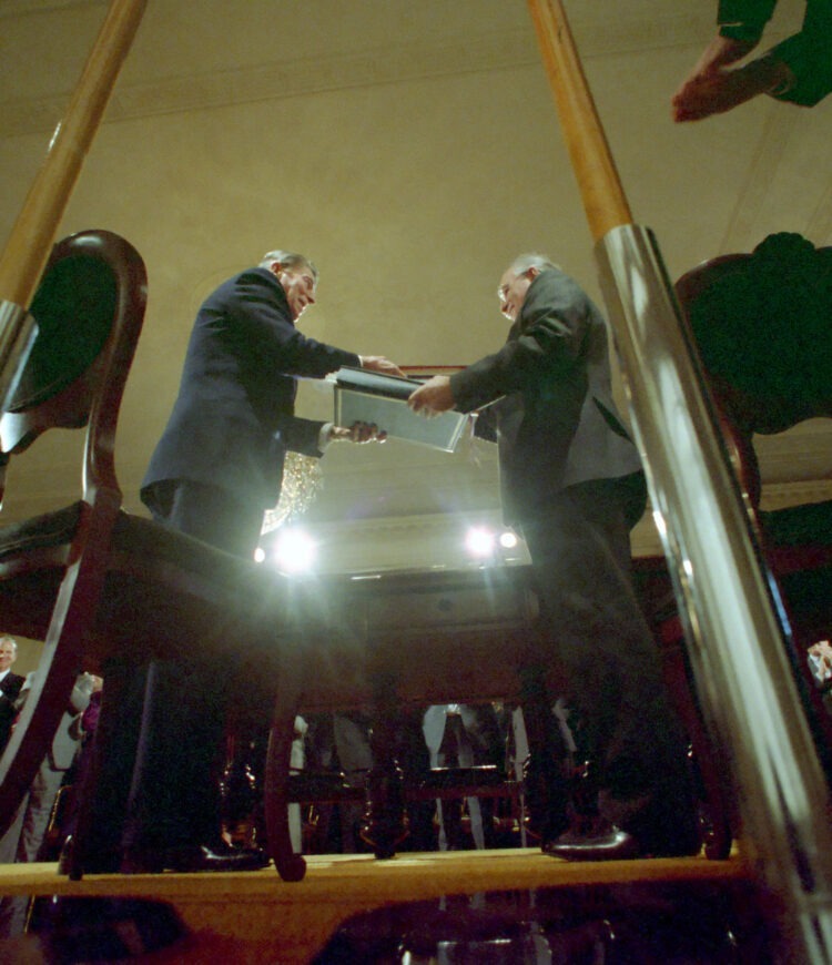 Low angle of President Reagan and Soviet General Secretary Gorbachev at the signing of the INF Treaty in the East Room