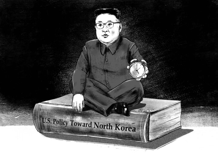 Pencil/charcoal drawn image of Kim Jong Un sitting on top of a book, holding an alarm clock. The book reads "U.S. Policy Toward North Korea" along the spine