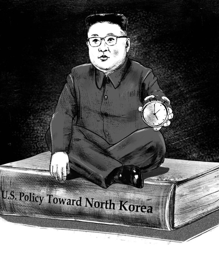 Pencil/charcoal drawn image of Kim Jong Un sitting on top of a book, holding an alarm clock. The book reads "U.S. Policy Toward North Korea" along the spine