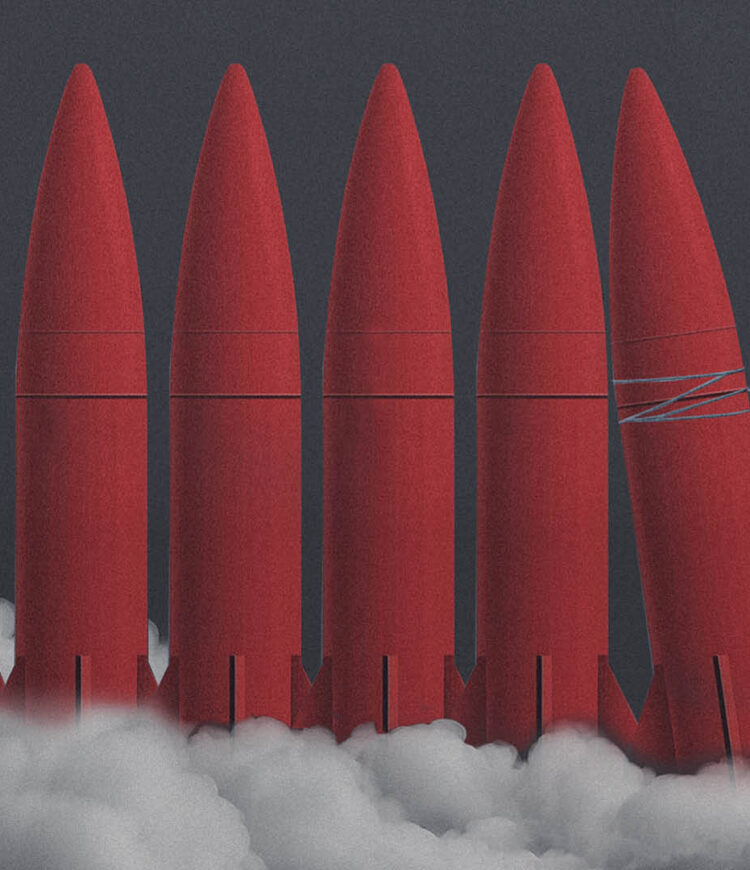 missiles being held up by a woman holding a rope